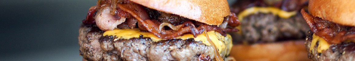 Eating American (Traditional) Burger Southern at JG's Old Fashioned Hamburgers restaurant in Dallas, TX.